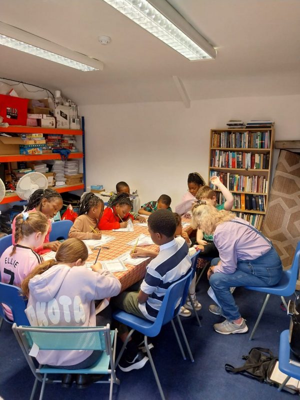 Children learning to bake during a Sunday school class